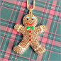 Preview: Halskette "Gingerbread Man, braun mit grüner Fliege" - 71 cm